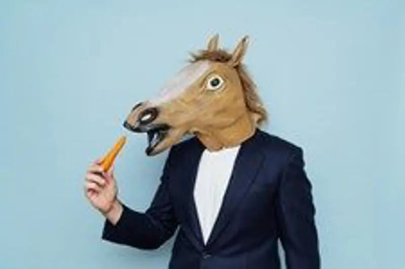 A man in a dark suit wearing a horse mask, holding a carrot